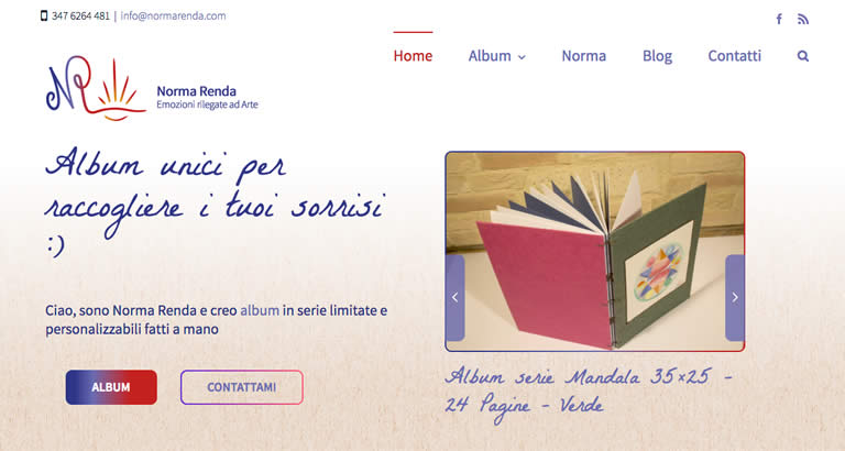 Website homepage of Norma Renda showcasing a handcrafted photo album with colorful covers, inviting customers to collect memorable moments.